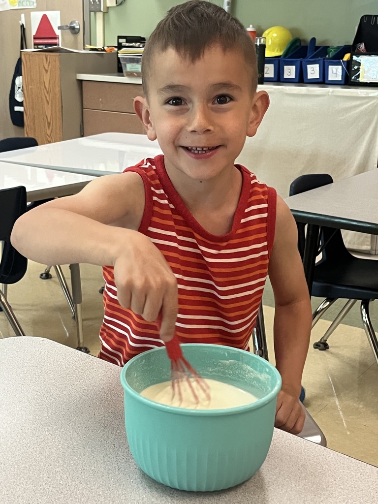 student smiling mixing ice cream
