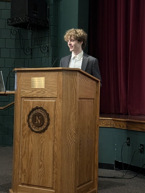 student speaking at the symposium
