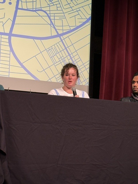student speaking at the symposium