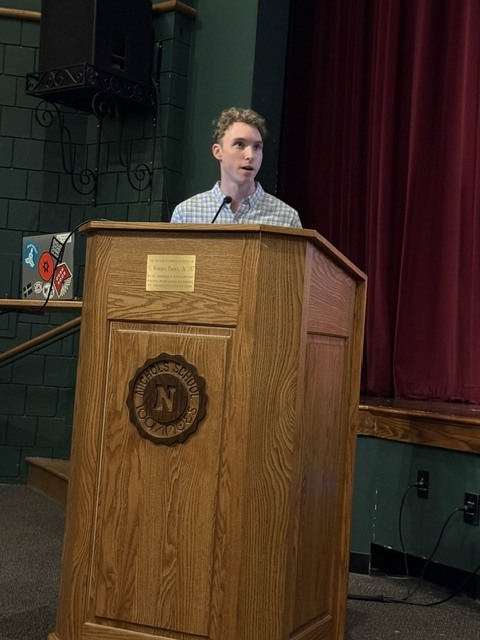 student speaking at the symposium