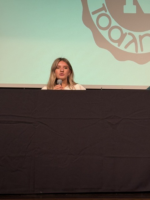 student speaking at the symposium