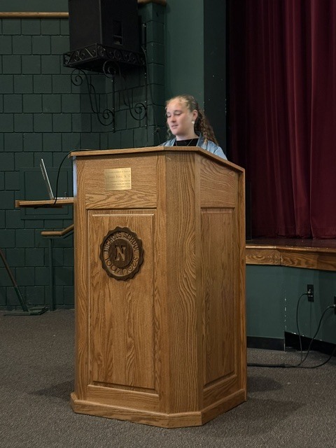 student speaking at the symposium
