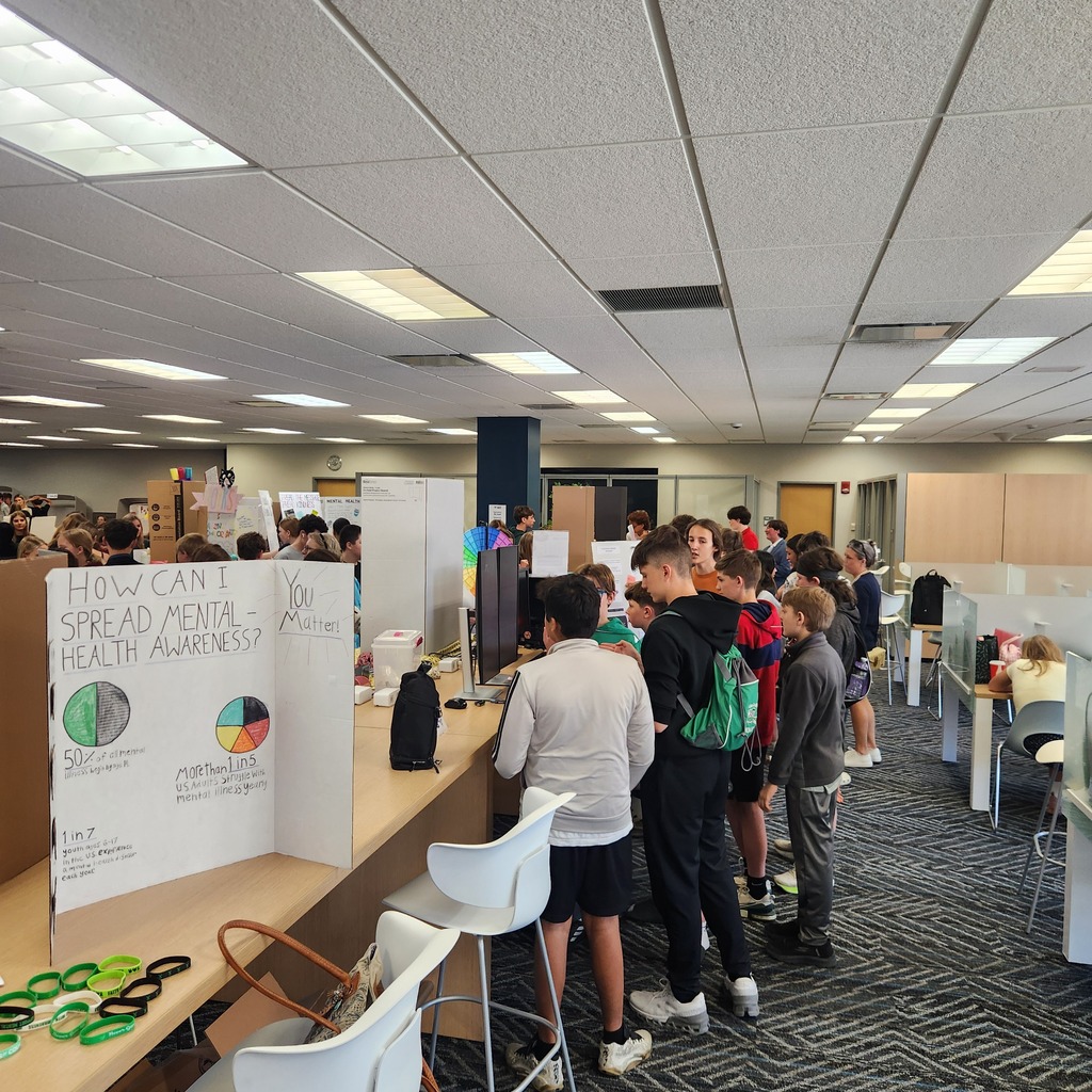 exhibit floor with students presenting projects