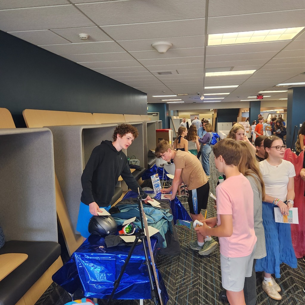 exhibit floor with students presenting projects