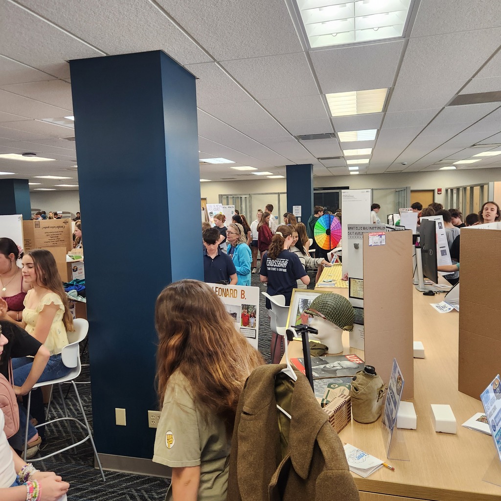 exhibit floor with students presenting projects