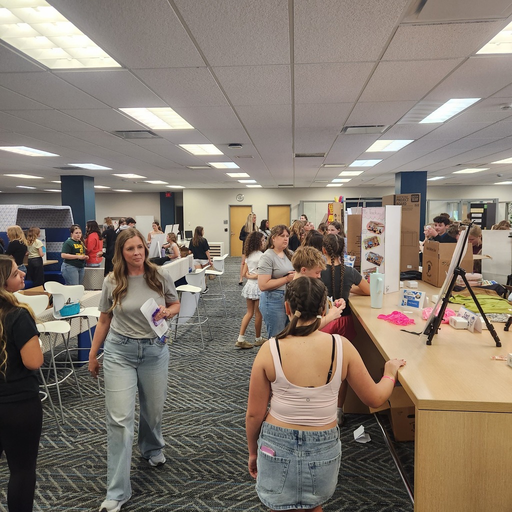exhibit floor with students presenting projects