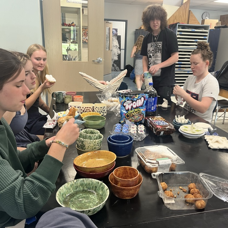ceramics students at critique