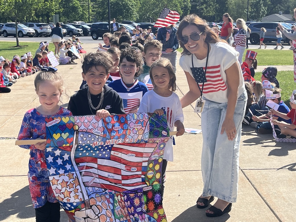 students holding their flag day poster