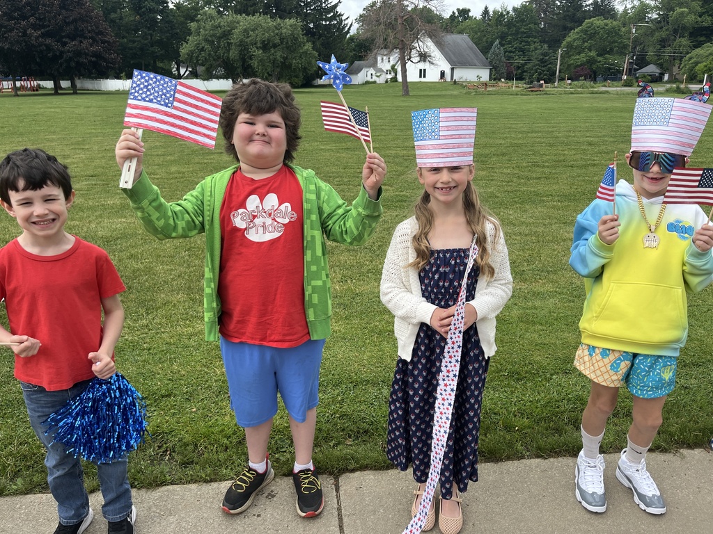 students displaying flags in the flag day parade