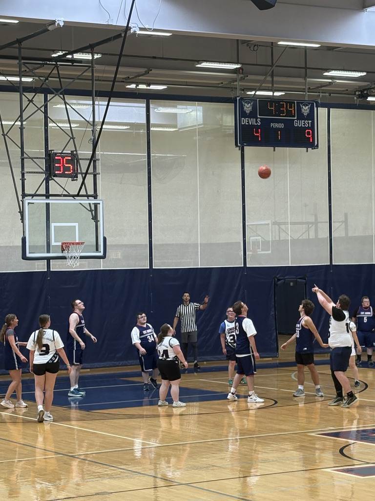 students playing basketball on the court