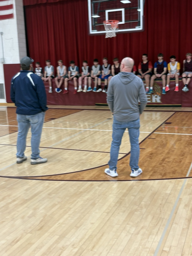Players from the 2000-2001 talking to the 25-26’ team.