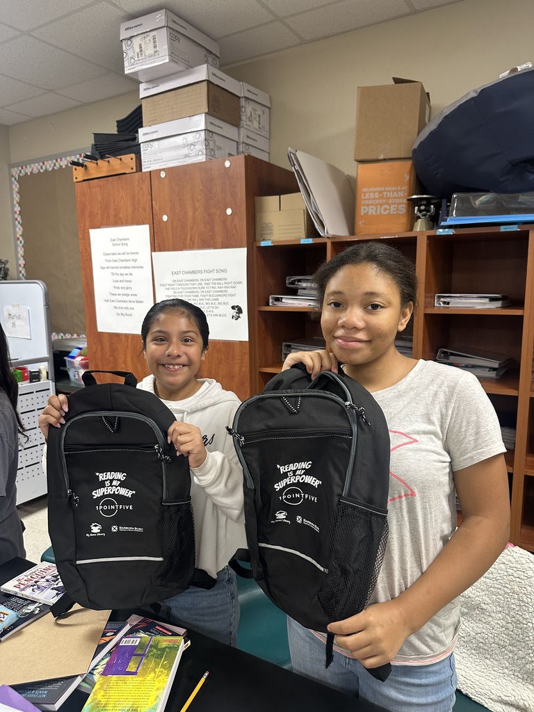 student holding book