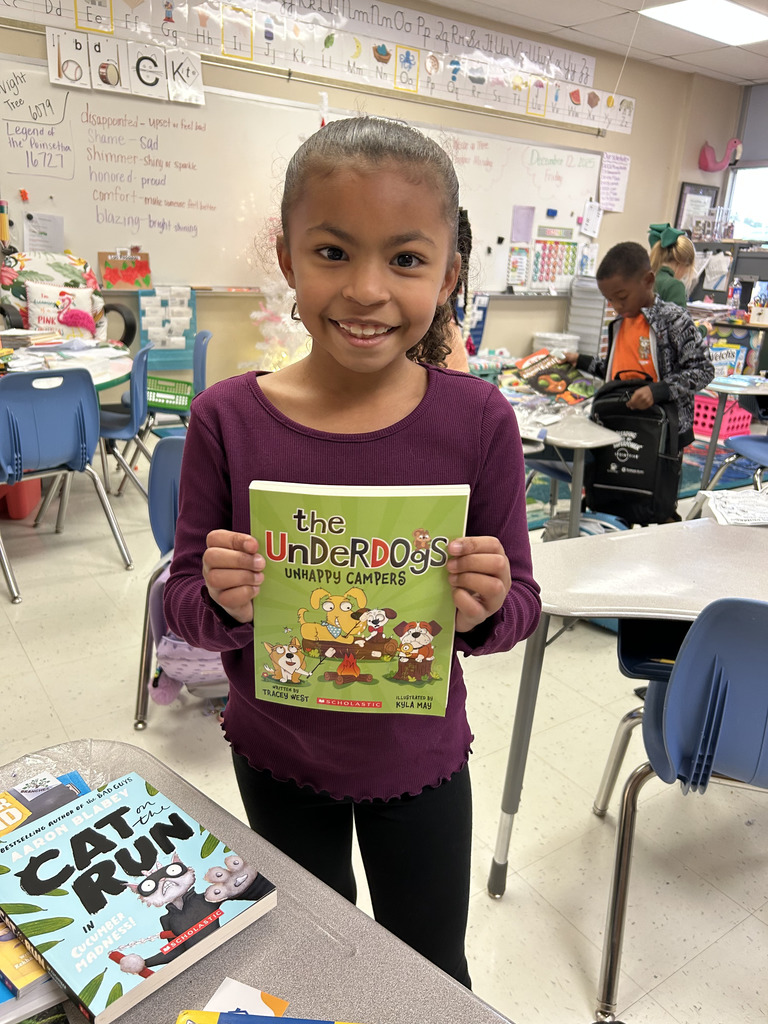 student holding book