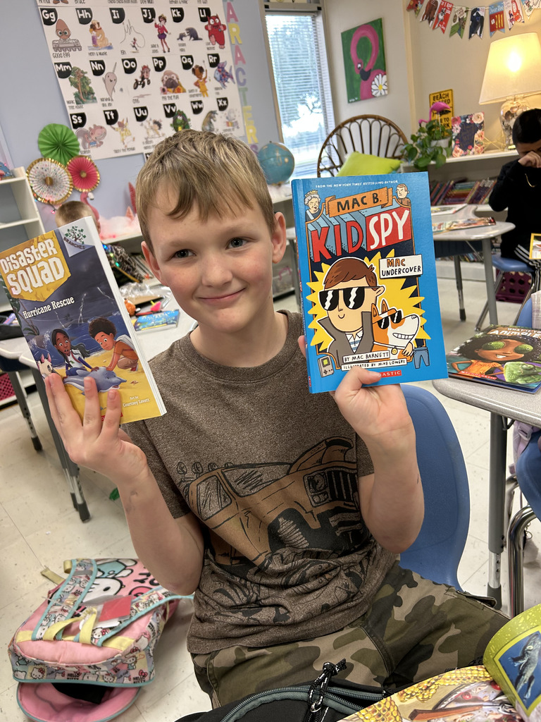 student holding book