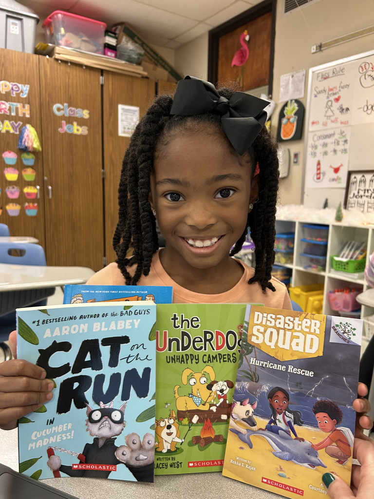 student holding book