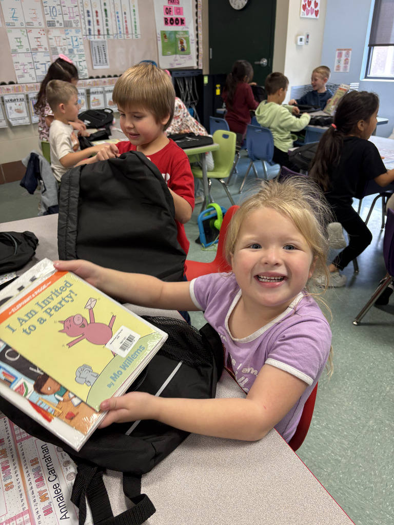 student holding book