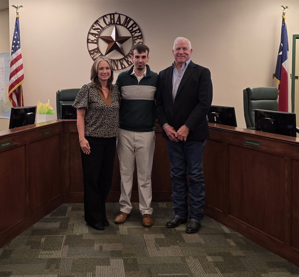 Matt Fowler with superintendent and board president