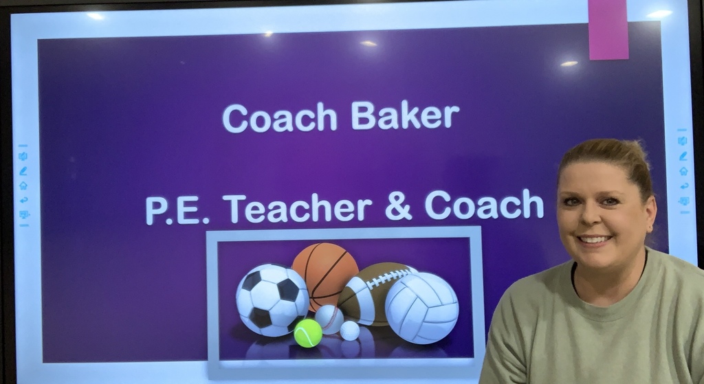 A woman smiles in front of a purple screen with text "Coach Baker P.E. Teacher & Coach" and an image of various sports balls.