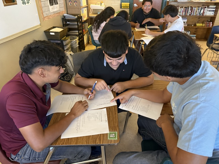 students engaged in writing activity 