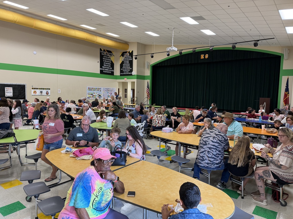 Grandparents and students eating lunch.