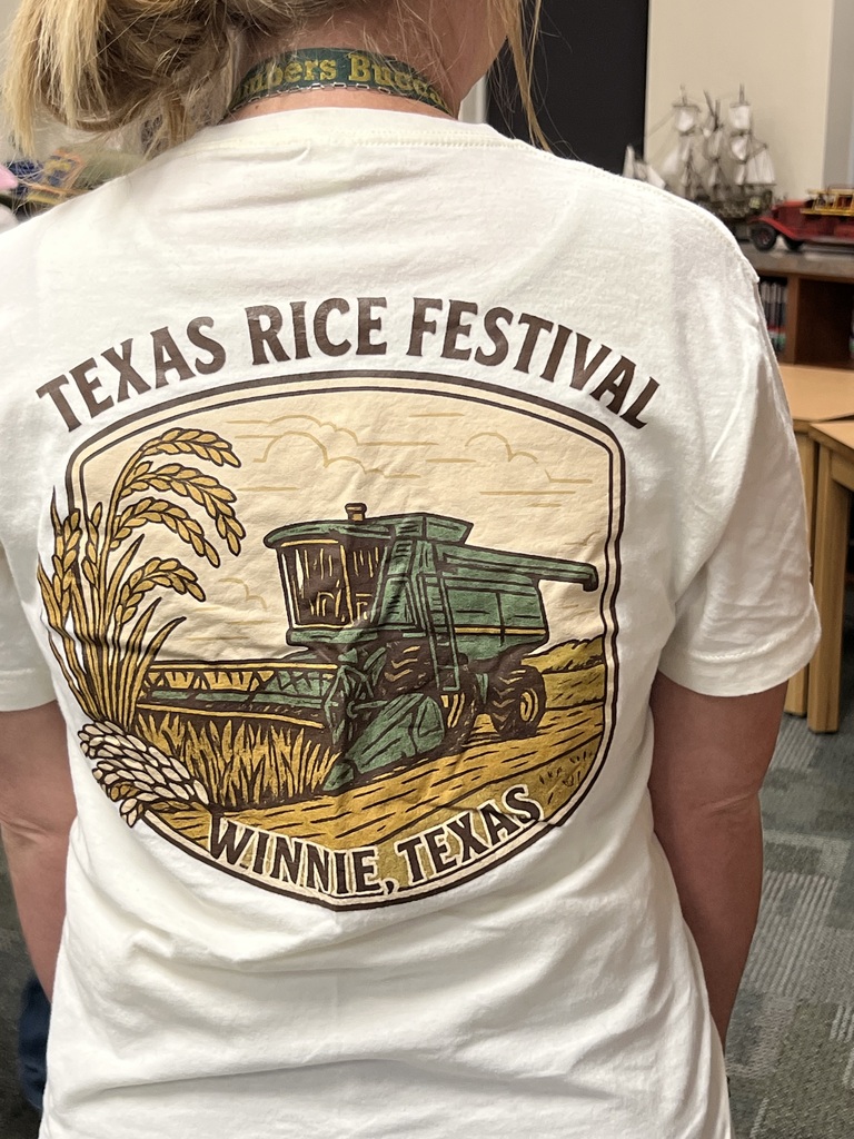 Woman wearing a white T-shirt that says "Texas Rice Festival Winnie, Texas" with a graphic of a harvester and wheat.