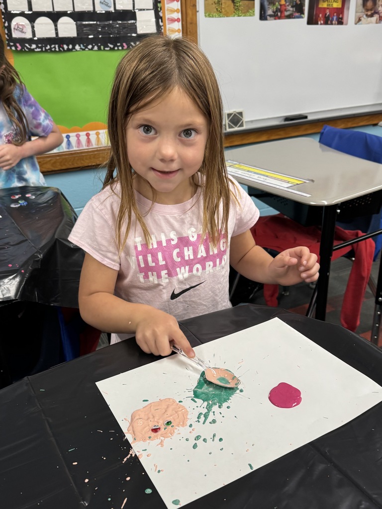First grader creating her monsters