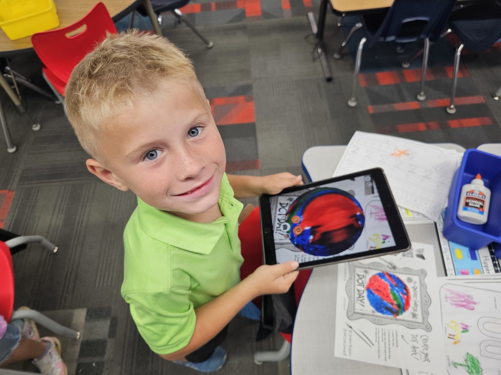 Student showing off his dot
