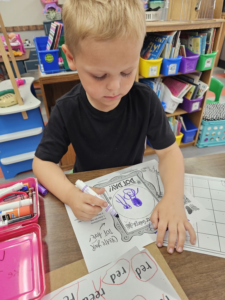 Student is coloring his dot