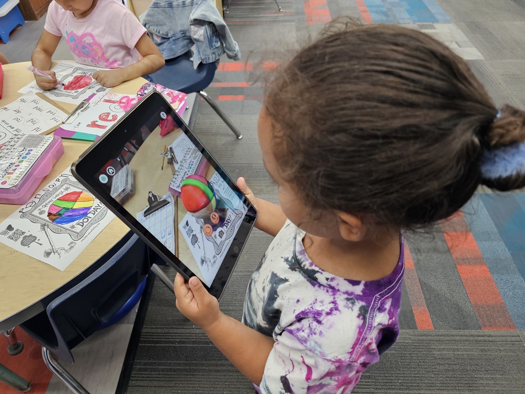Student looking at her beach ball dot
