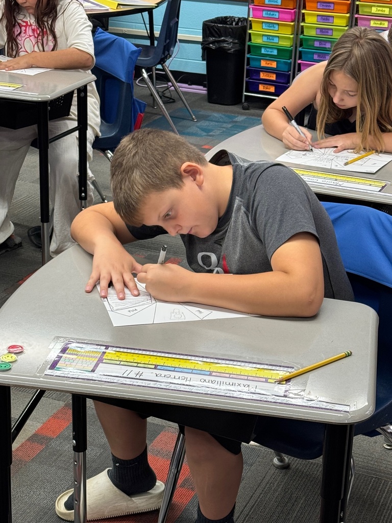 Student focusing on his drawing