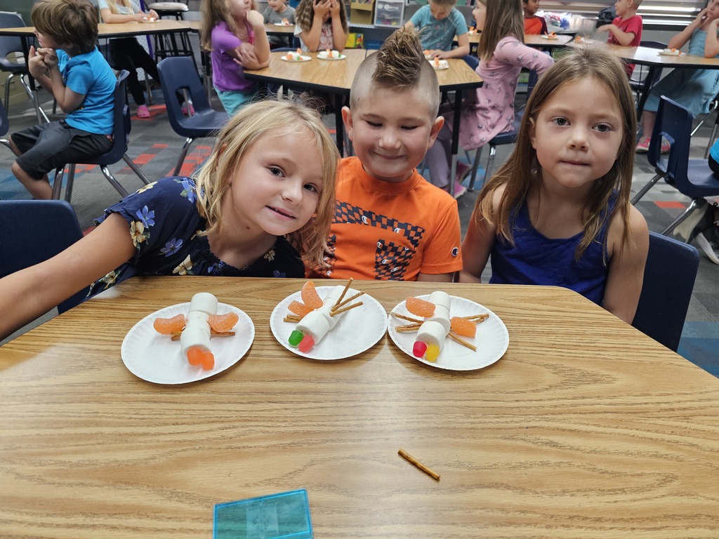 Three students with their insects