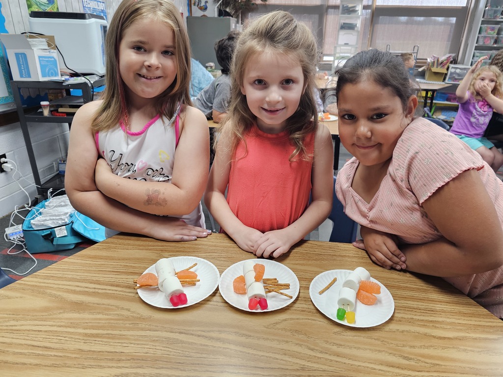 Three students with their insects