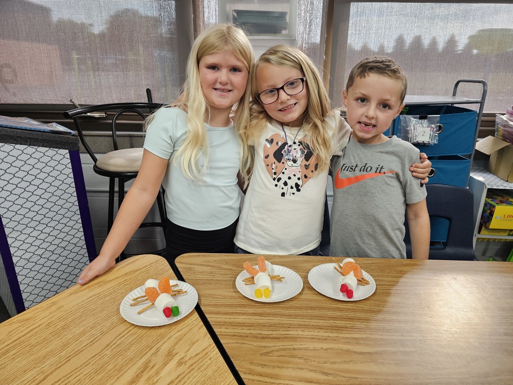 Three students with their insects