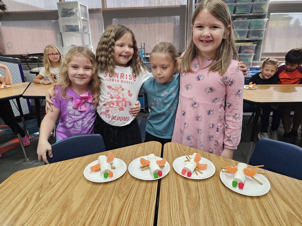 Four students with their insects
