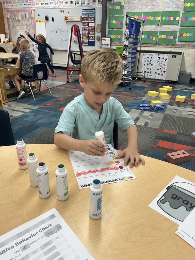 Student painting dots