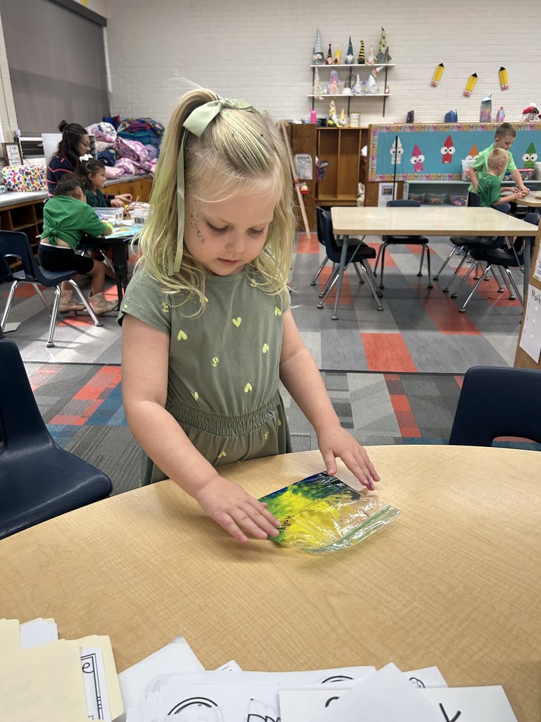 Student mixing colors