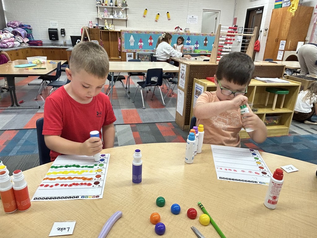 Students making color dots