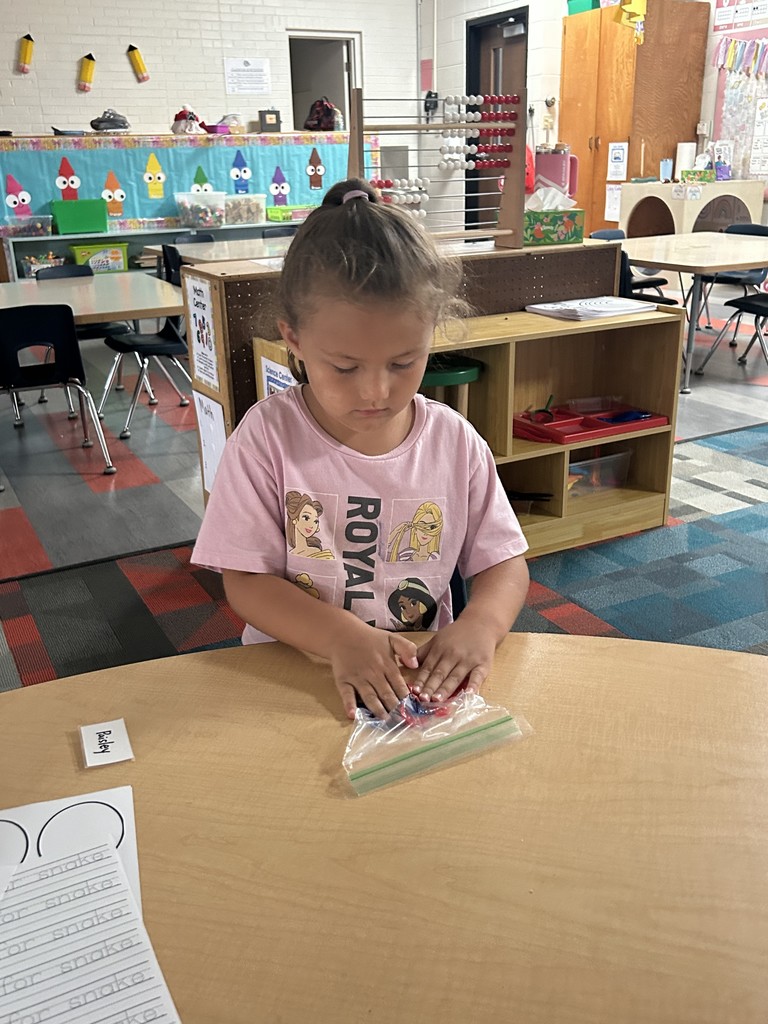 Student mashing together colors