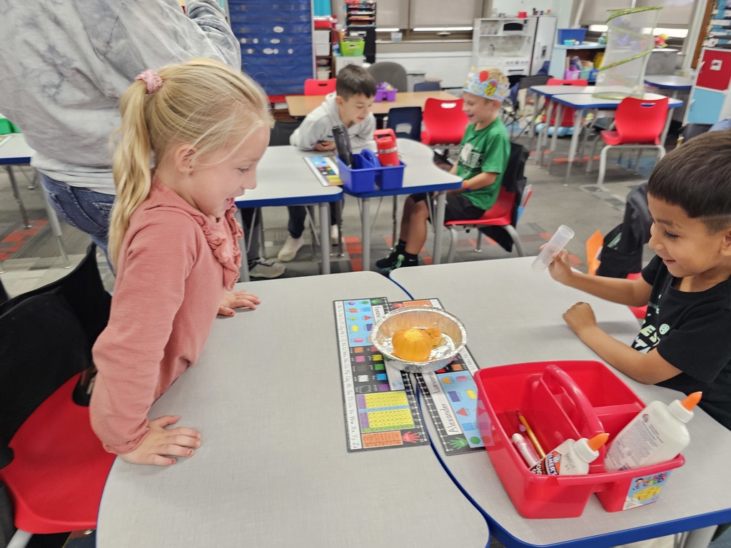 Students watching the pumpkin bubble