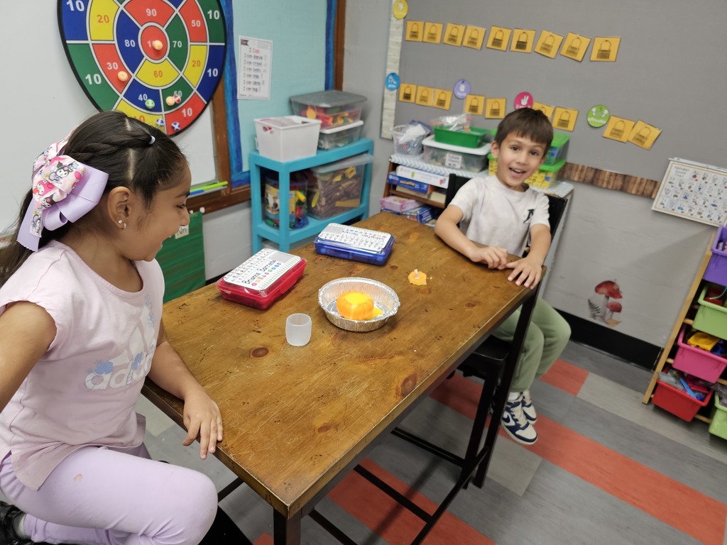 Two students excited about their magic pumpkin