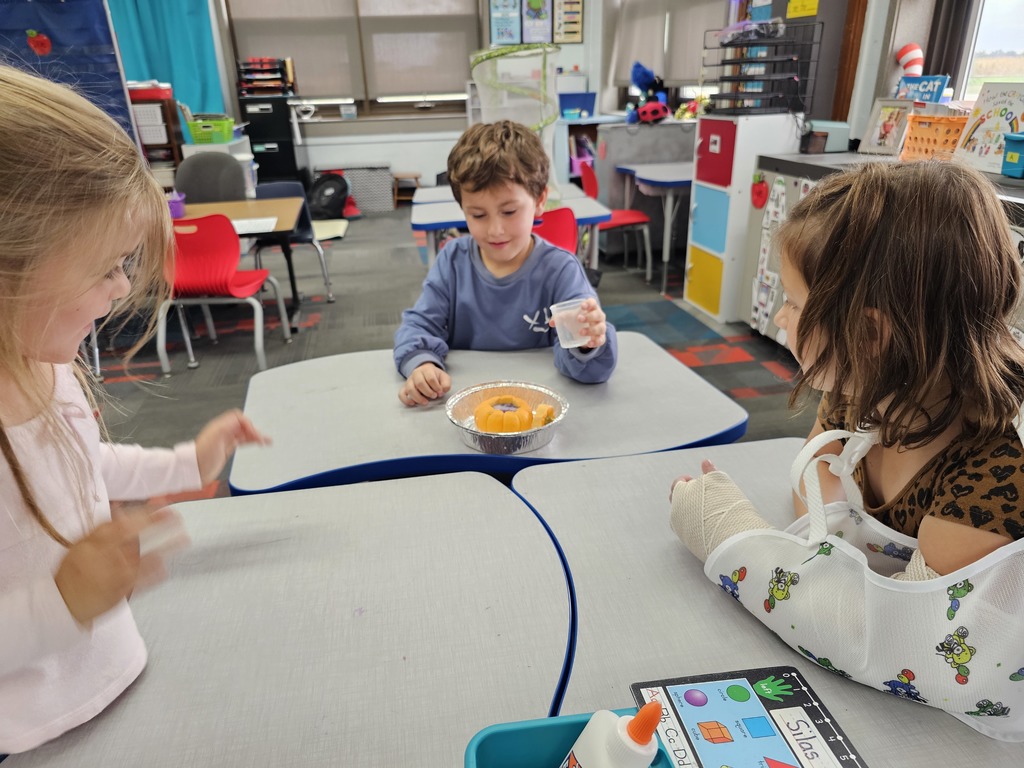 Pouring vinegar into the pumpkin with the antacid tablet