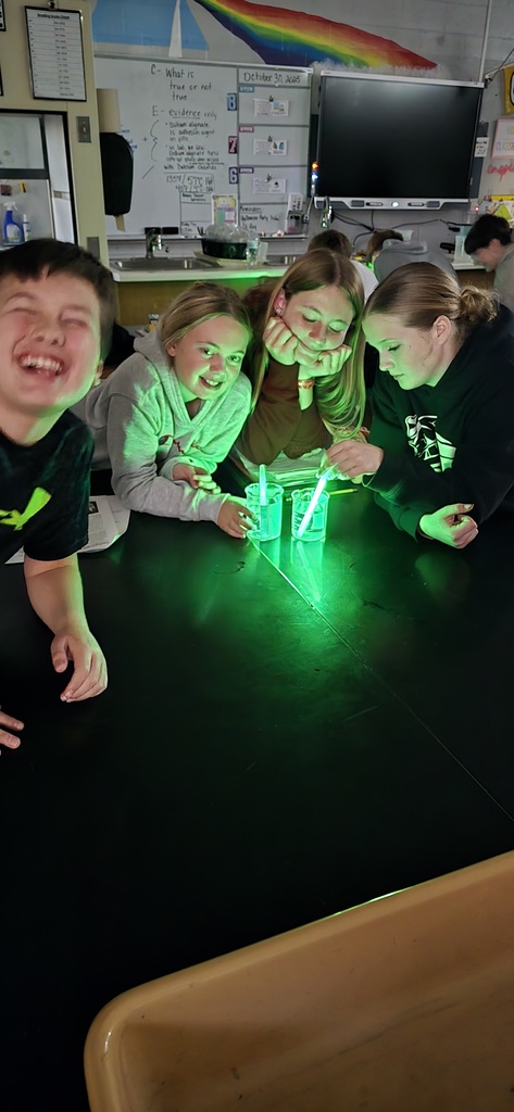 Students watching their glowsticks