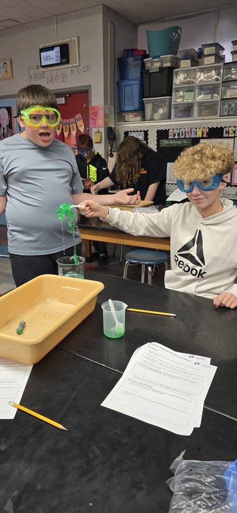 Two boys showing off the end product