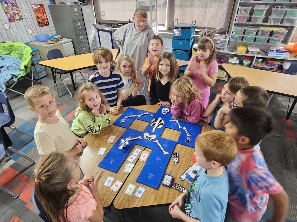 Students cheering on the robot