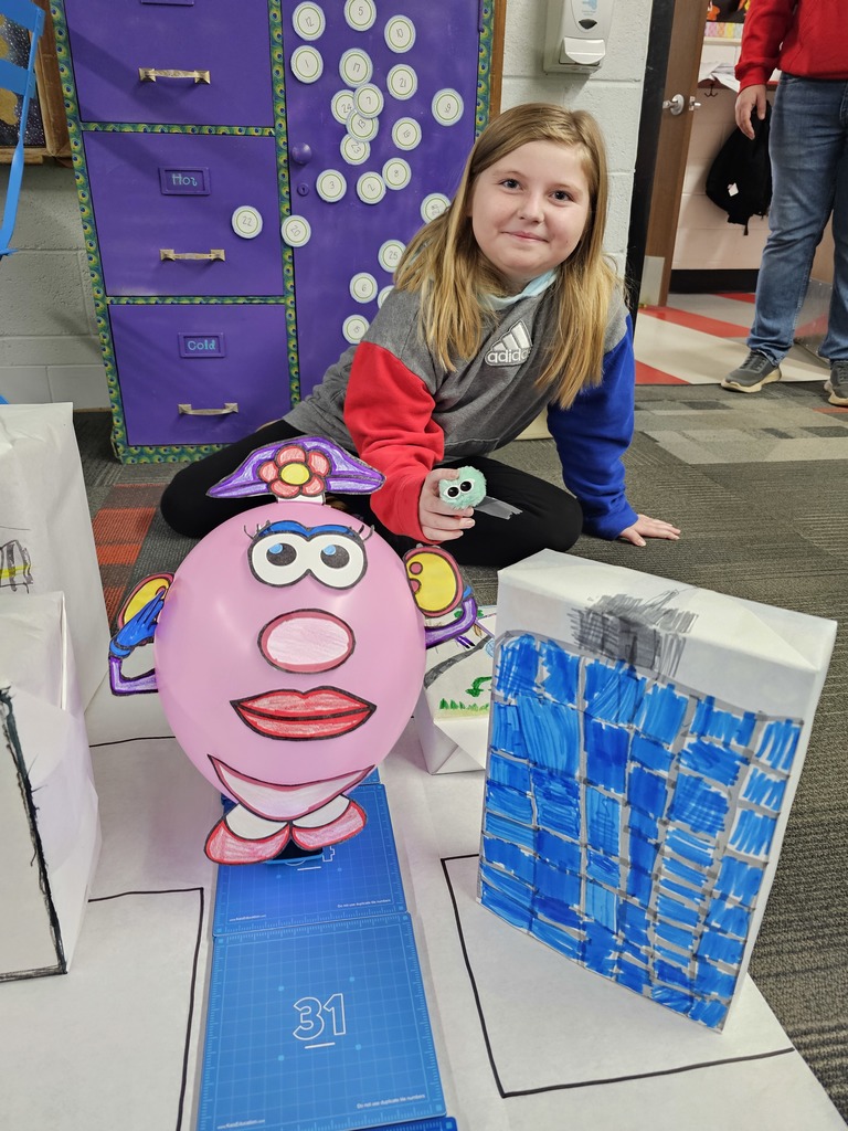 Student with her Mrs. Potato Head balloon