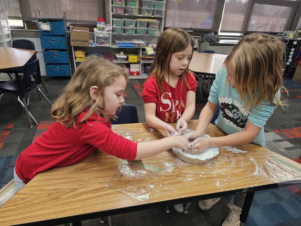 Three girls making snow
