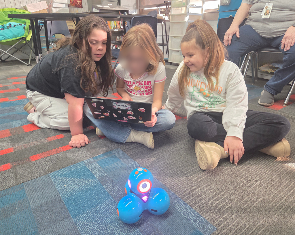 Three students coding Dash