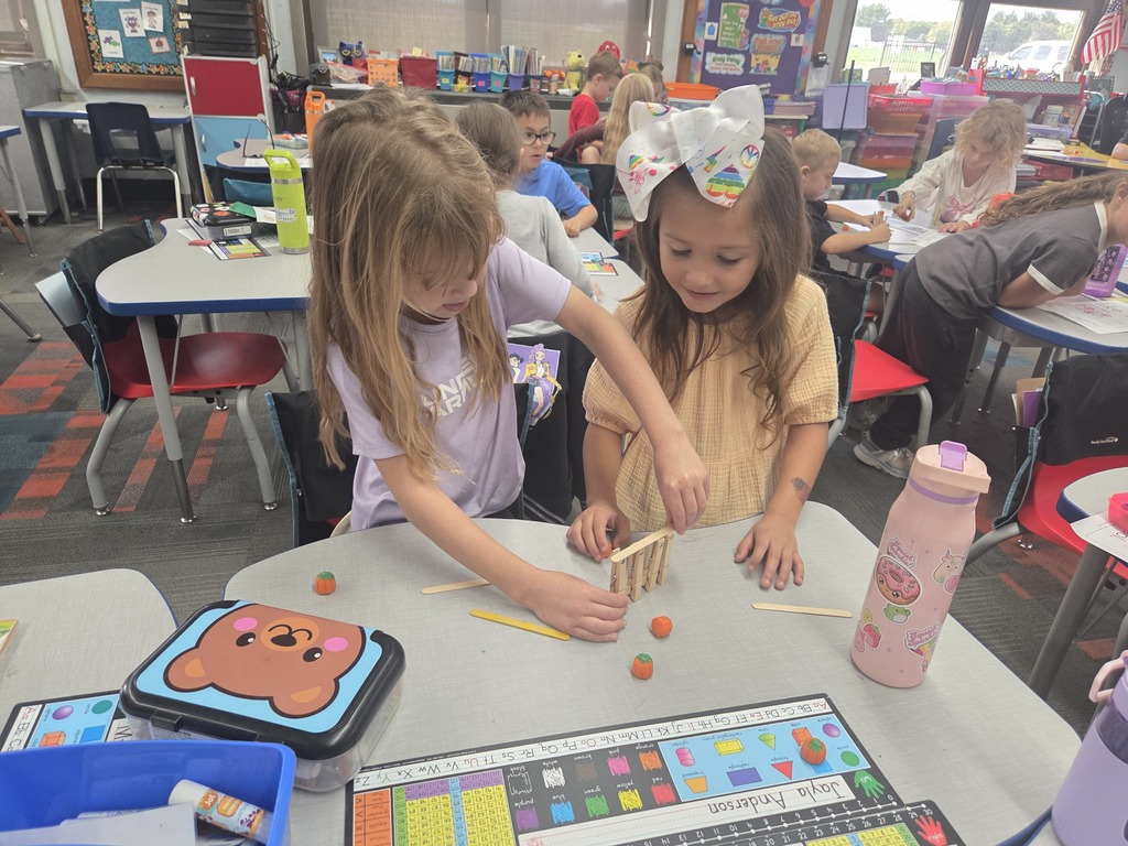 Two girls building their gates