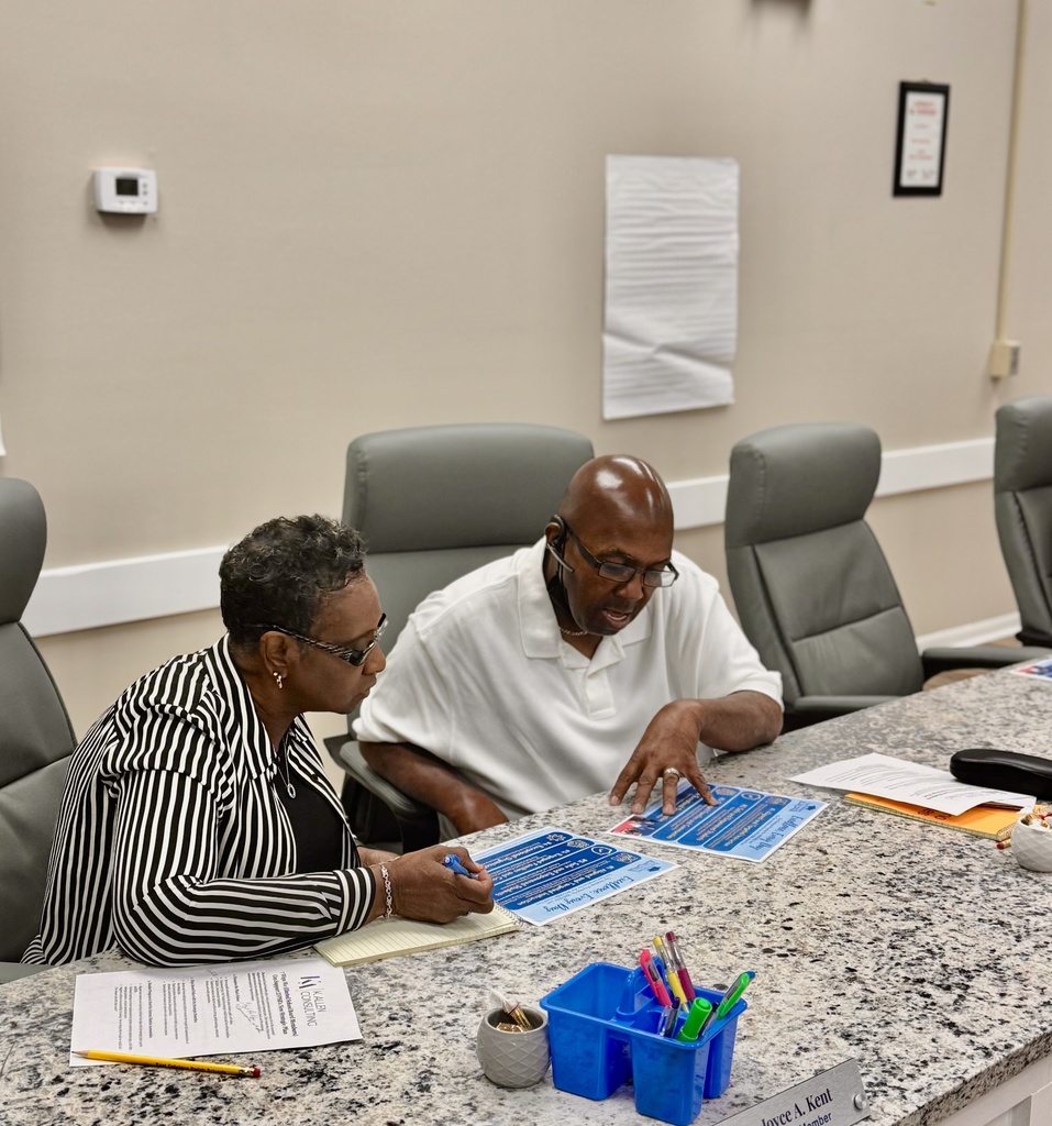 Two board members collaborate.
