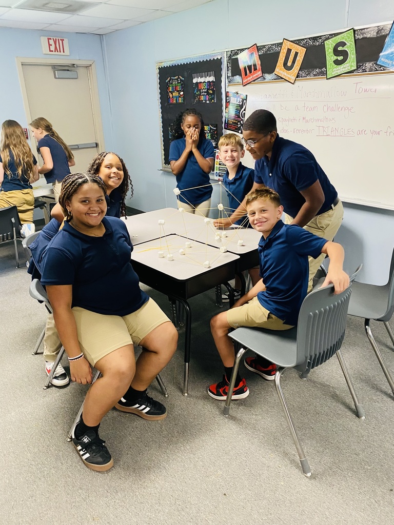 Students smiling and collaborating.